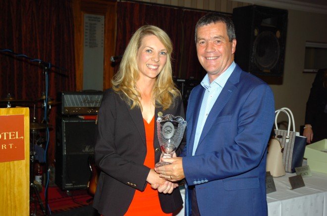 Noel Dempsey receives the Lady Captain's Prize to the Men from Lady captain, Elva Leavy