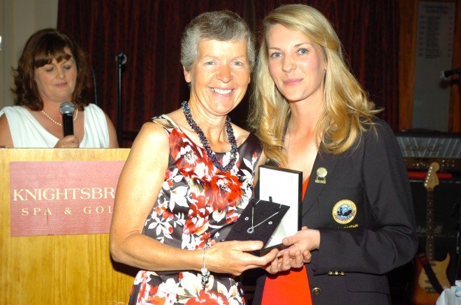 Stella McLoughlin receives her prize from Lady Captain, Elva Leavy.