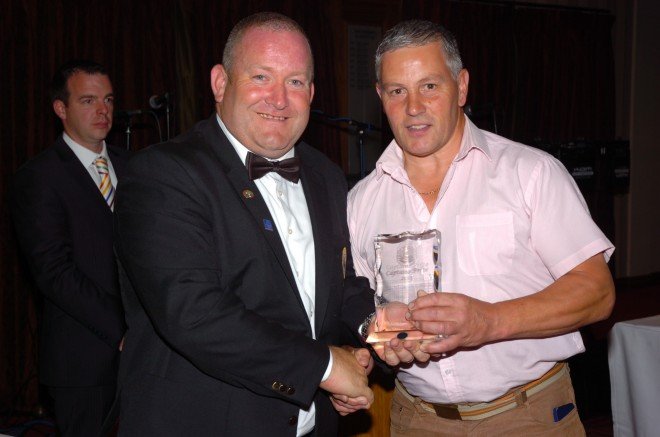 Ken Butterfield receives his Captain's Prize from Captain, Colin McAllister